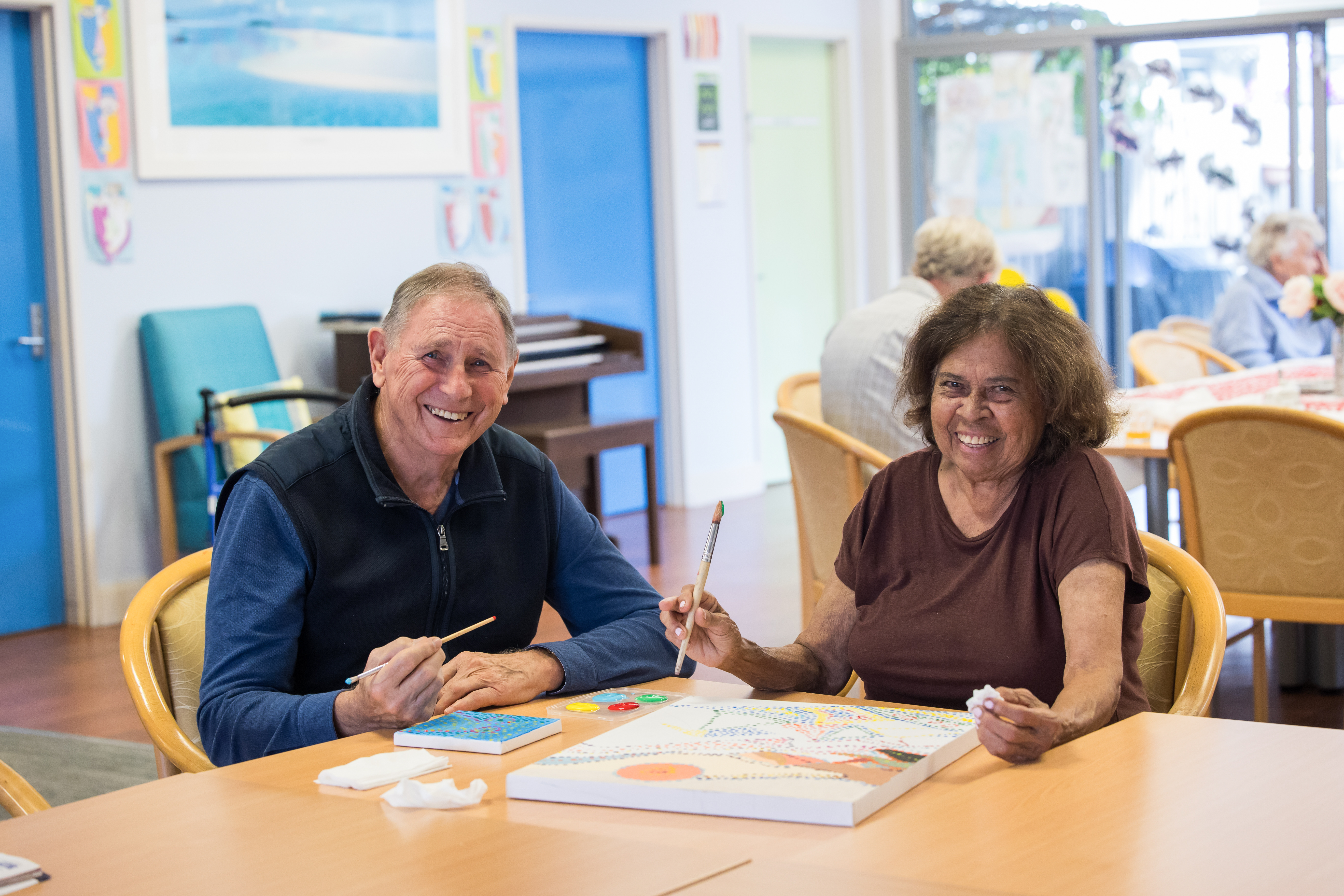 Madeline and client doing art at AC